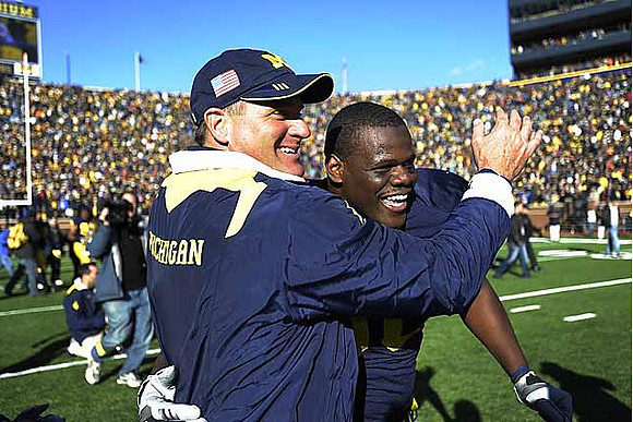 Rich Rodriguez and Martell Webb (80)