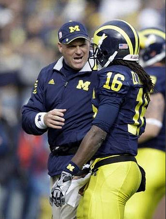 Rich Rodriguez and Denard Robinson (16)
