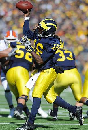 Denard Robinson (16), Stephen Schilling (52), and Stephen Hopkins (33)