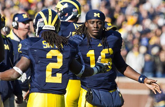 Vincent Smith (2), Denard Robinson (16), and Taylor Lewan (77)