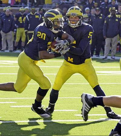 Michael Shaw (20) and Tate Forcier (5)