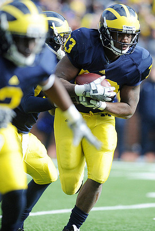 Stephen Hopkins (33), Vincent Smith (2), and Denard Robinson (16)