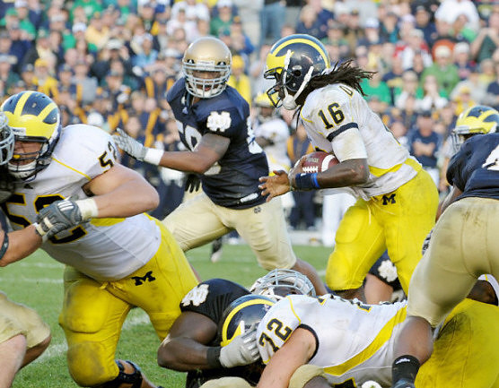 Stephen Schilling (52), Mark Huyge (72), and Denard Robinson (16)