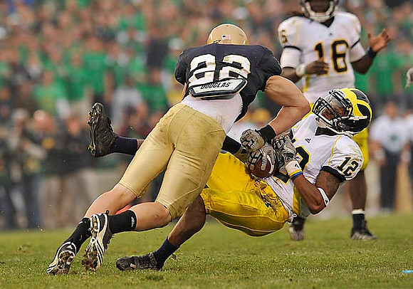 Roy Roundtree (12) and Denard Robinson (16)