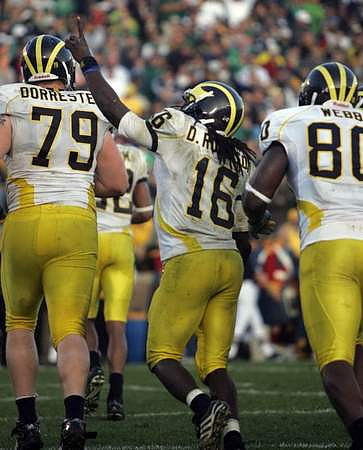 Perry Dorrestein (79), Denard Robinson (16), and Martell Webb (80)
