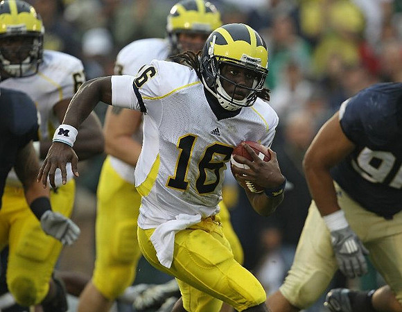 Patrick Omameh (65) and Denard Robinson (16)