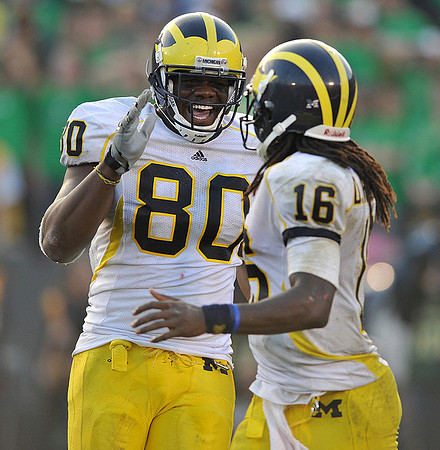 Martell Webb (80) and Denard Robinson (16)