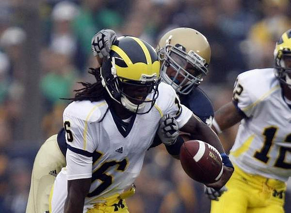 Denard Robinson (16) and Roy Roundtree (12)