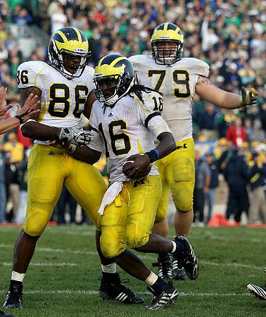 Kevin Koger (86), Denard Robinson (16), and Perry Dorrestein (79)