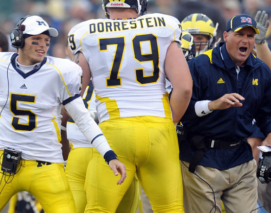 Tate Forcier (5), Perry Dorrestein (79), and Rich Rodriguez
