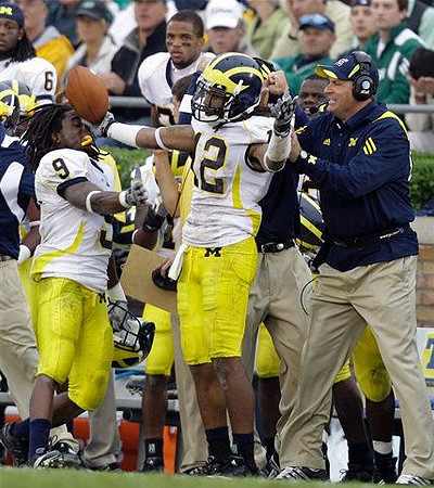 Martavious Odoms (9), Roy Roundtree (12), and Rich Rodriguez