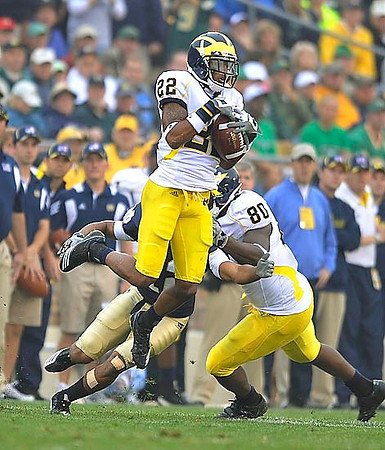 Darryl Stonum (22) and Martell Webb (80)