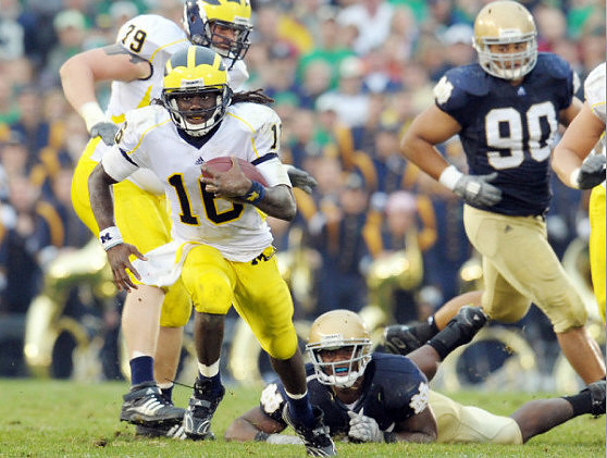 Perry Dorrestein (79) and Denard Robinson (16)