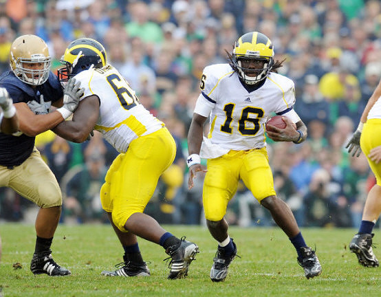 Patrick Omameh (65) and Denard Robinson (16)