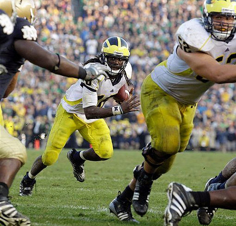 Denard Robinson (16) and Stephen Schilling (52)