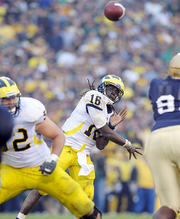 Stephen Schilling (52) and Denard Robinson (16)