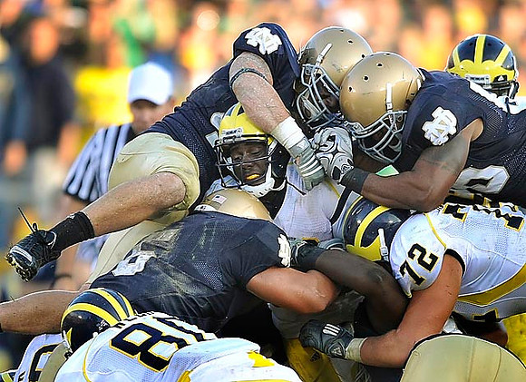 Martell Webb (80), Denard Robinson (16), and Mark Huyge (72)