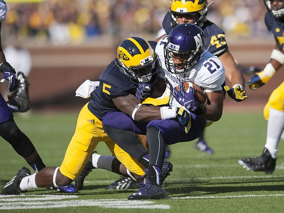 Jabrill Peppers (5) and Chris Wormley (43)