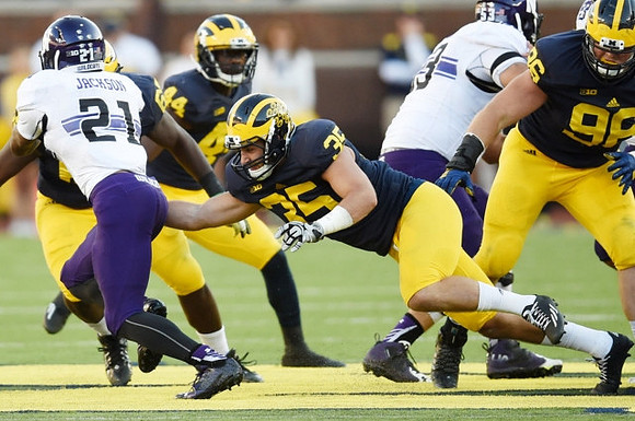 Delano Hill (44), Joe Bolden (35), and Ryan Glasgow (96)