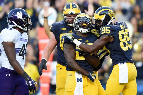 Kyle Kalis (67), Derrick Green (27), and Maurice Ways (85)