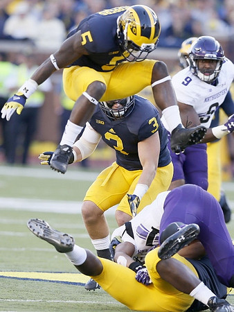Jabrill Peppers (5) and  Desmond Morgan (3)