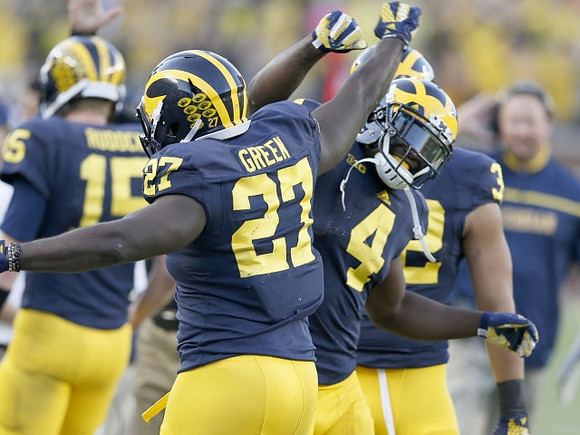 Jake Rudock (15), Derrick Green (27), De'Veon Smith (4), and Ty Isaac (32)