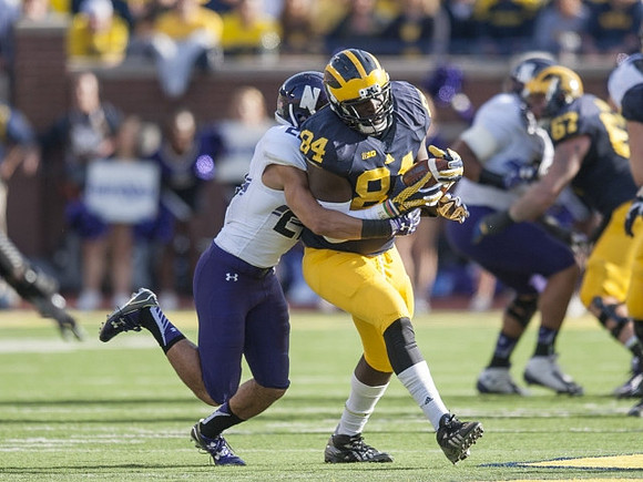 A.J. Williams (84) and Kyle Kalis (67)