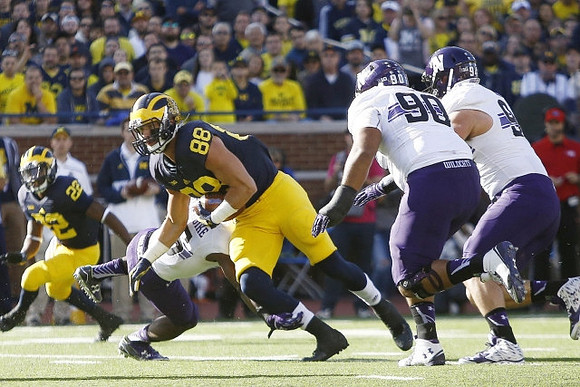 Karan Higdon (22) and Jake Butt (88)