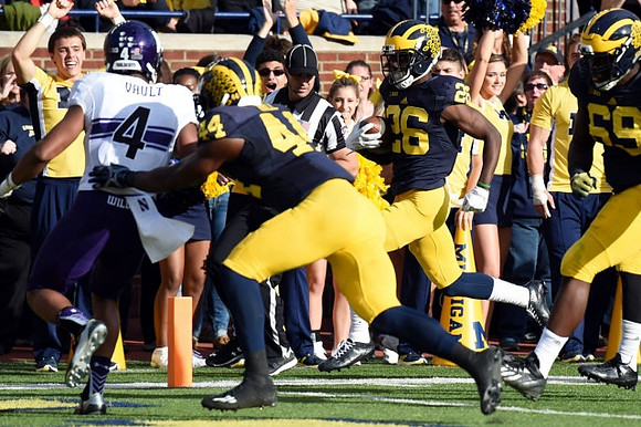 Delano Hill (44), Jourdan Lewis (26), and Willie Henry (69)
