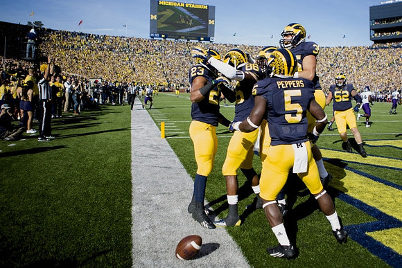 Tyree Kinnel (23), Jehu Chesson (86), Jabrill Peppers (5), Joe Bolden (35), and Mason Cole (52)