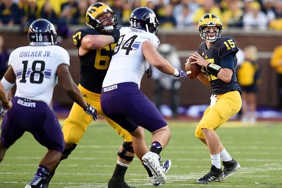 Kyle Kalis (67) and Jake Rudock (15)
