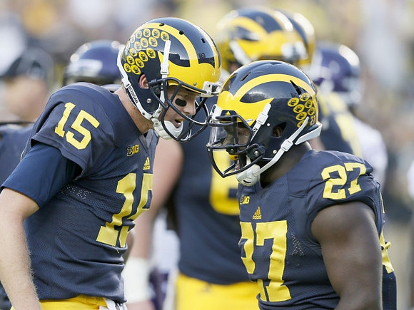 Jake Rudock (15) and Derrick Green (27)