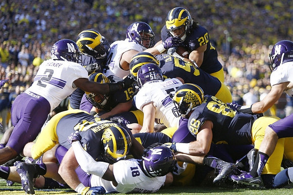 Erik Magnuson (78), Jake Rudock (15), Mason Cole (52), Drake Johnson (20), and Jake Butt (88)