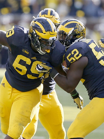 Willie Henry (69) and Royce Jenkins-Stone (52)
