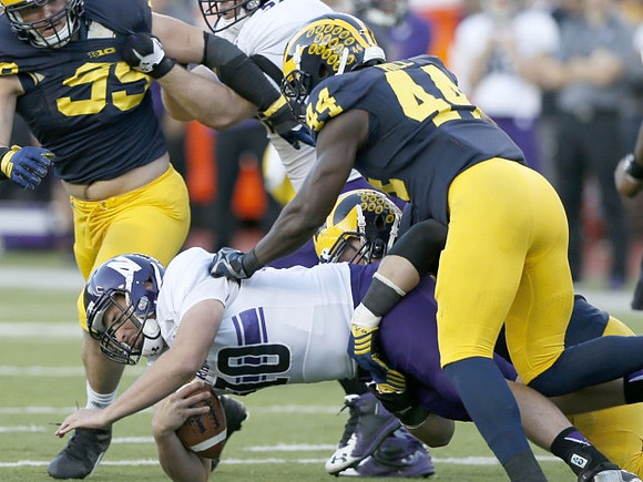Matthew Godin (99) and Delano Hill (44)