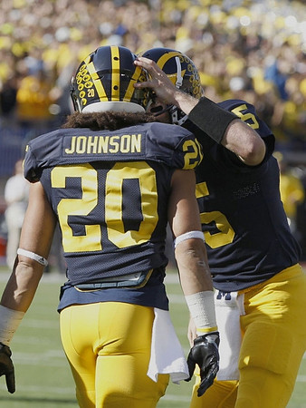 Drake Johnson (20) and Jake Rudock (15)