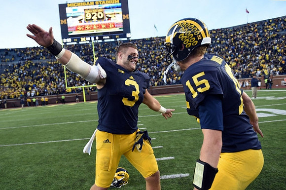 Desmond Morgan (3) and Jake Rudock (15)