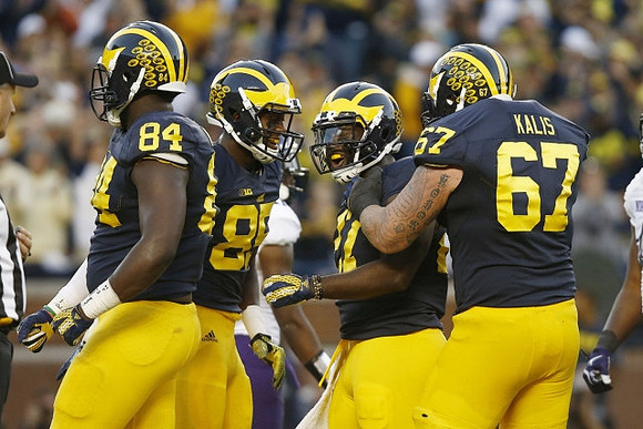 A.J. Williams (84), Maurice Ways (85), Derrick Green (27), and Kyle Kalis (67)