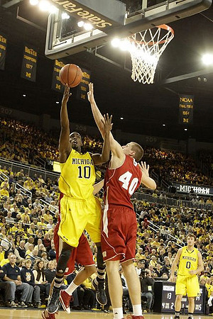 Tim Hardaway Jr. (10) and Zack Novak (0)