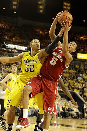 Jordan Morgan (52) and Zack Novak (0)