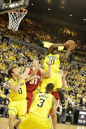 Zack Novak (0), Trey Burke (3), and Tim Hardaway Jr. (10)