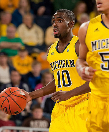 Tim Hardaway Jr. (10) and Jordan Morgan (52)