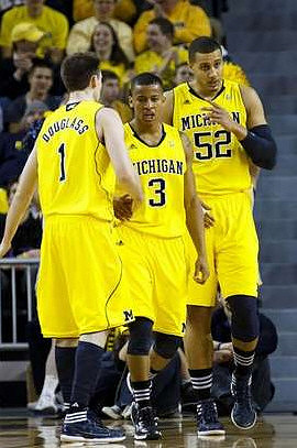 Stu Douglass (1), Trey Burke (3), and Jordan Morgan (52)