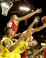 Trey Burke (3) and Blake McLimans (22)