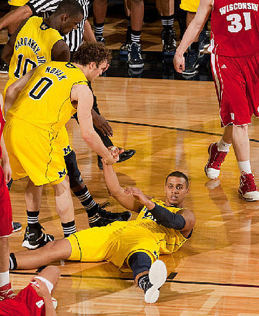 Tim Hardaway Jr. (10), Zack Novak (0), and Jordan Morgan (52)