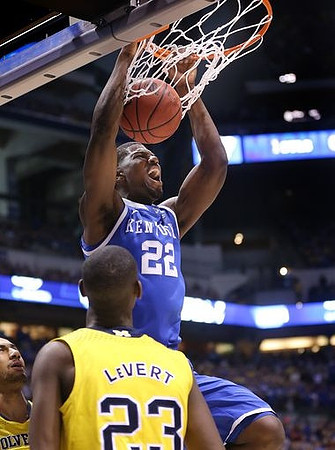 Jon Horford (15) and Caris LeVert (23)