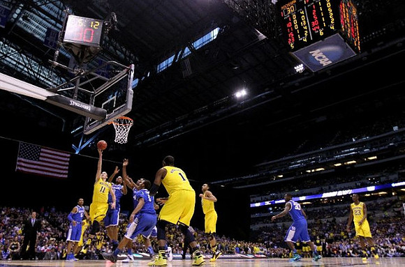 Nik Stauskas (11), Glenn Robinson III (1), Jon Horford (15), and Caris LeVert (23)