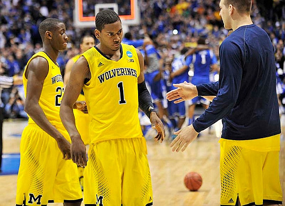 Caris LeVert (23), Glenn Robinson III (1), and Mitch McGary (4)