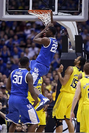 Caris LeVert (23), Jon Horford (15), and Spike Albrecht (2)