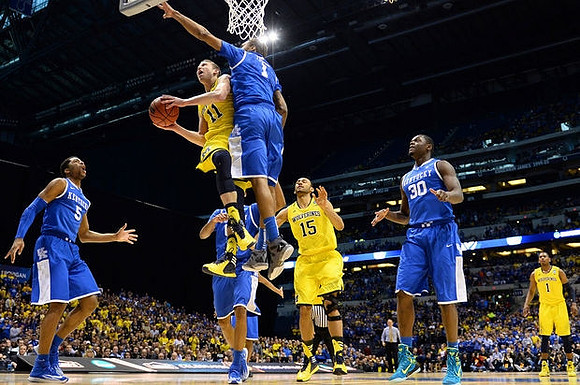 Nik Stauskas (11), Jon Horford (15), and Glenn Robinson III (1)